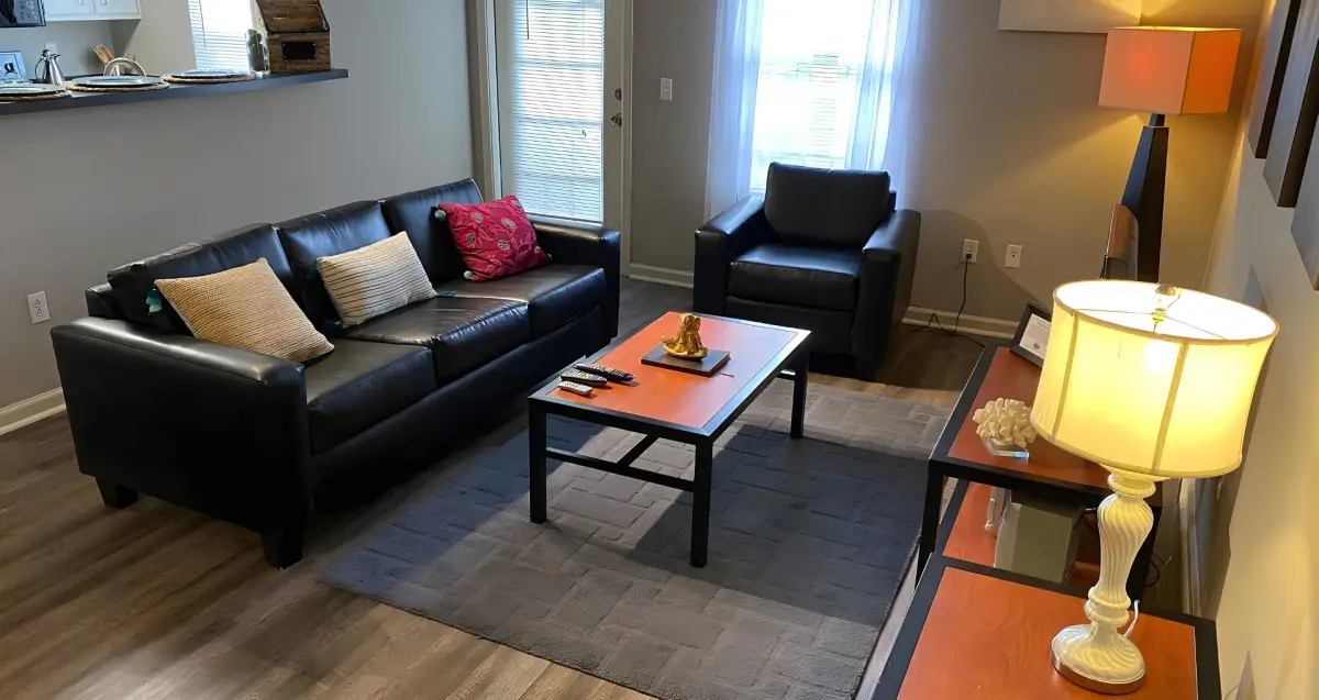 Student apartment living room with seating area at The Ridge near West Virginia University.