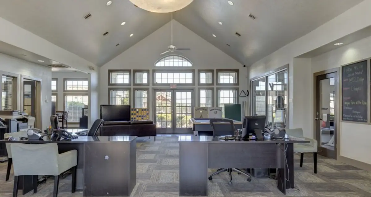 Community study space with computers at The Ridge, WVU off-campus apartments in Morgantown.